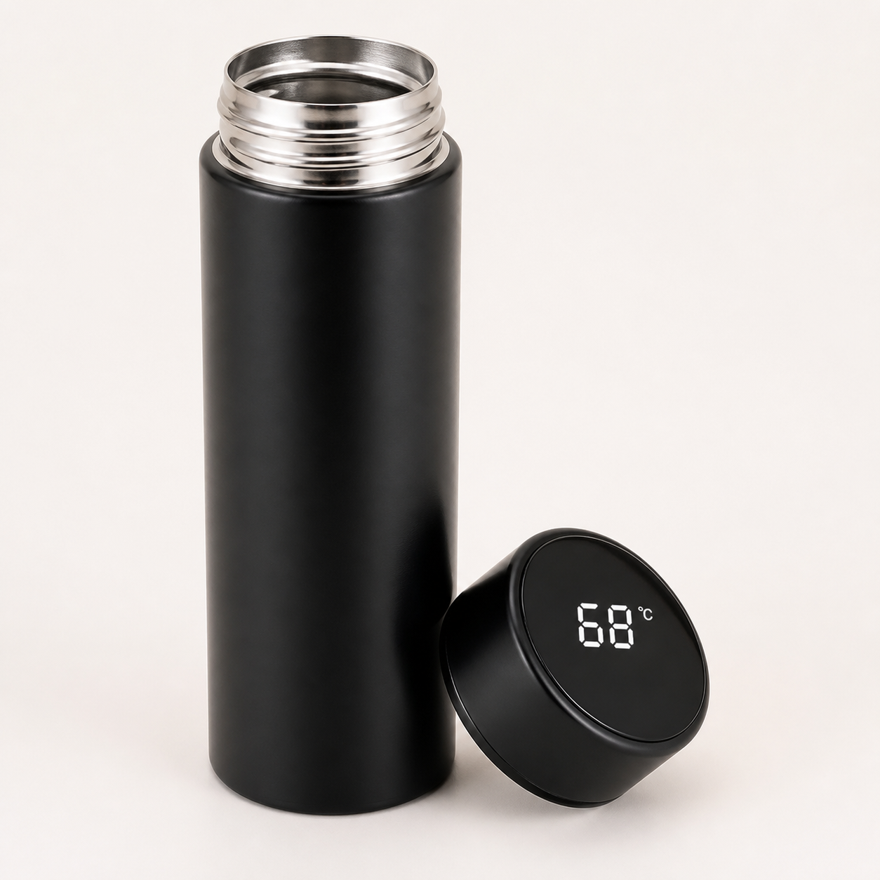 Open matte black smart water bottle showing stainless-steel interior and removable LCD temperature lid